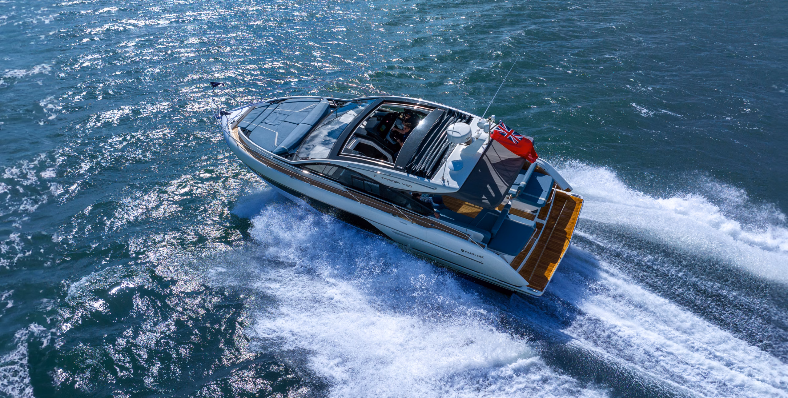 Luxury yacht cruising on blue water.