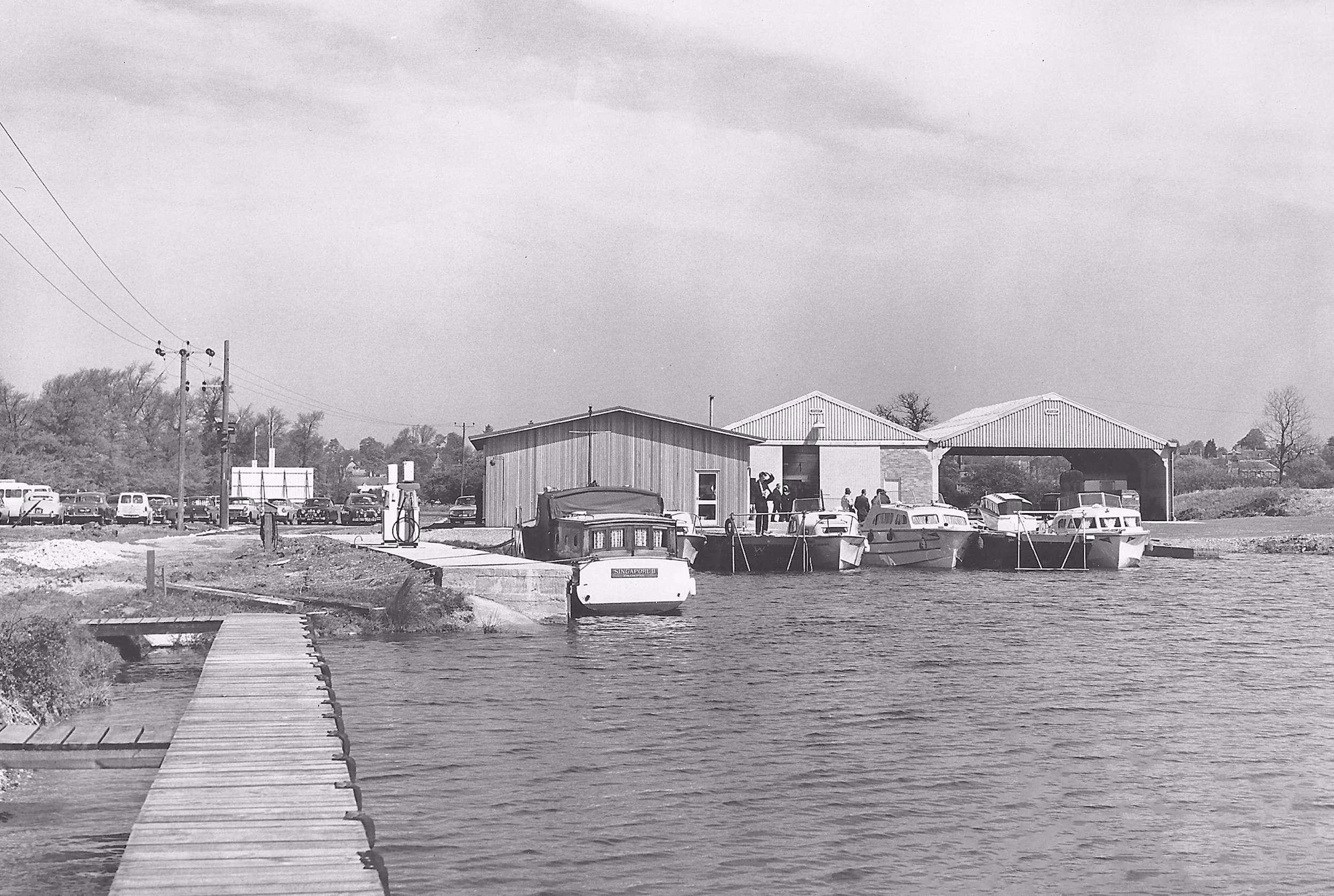 Boats moored at riverside buildings