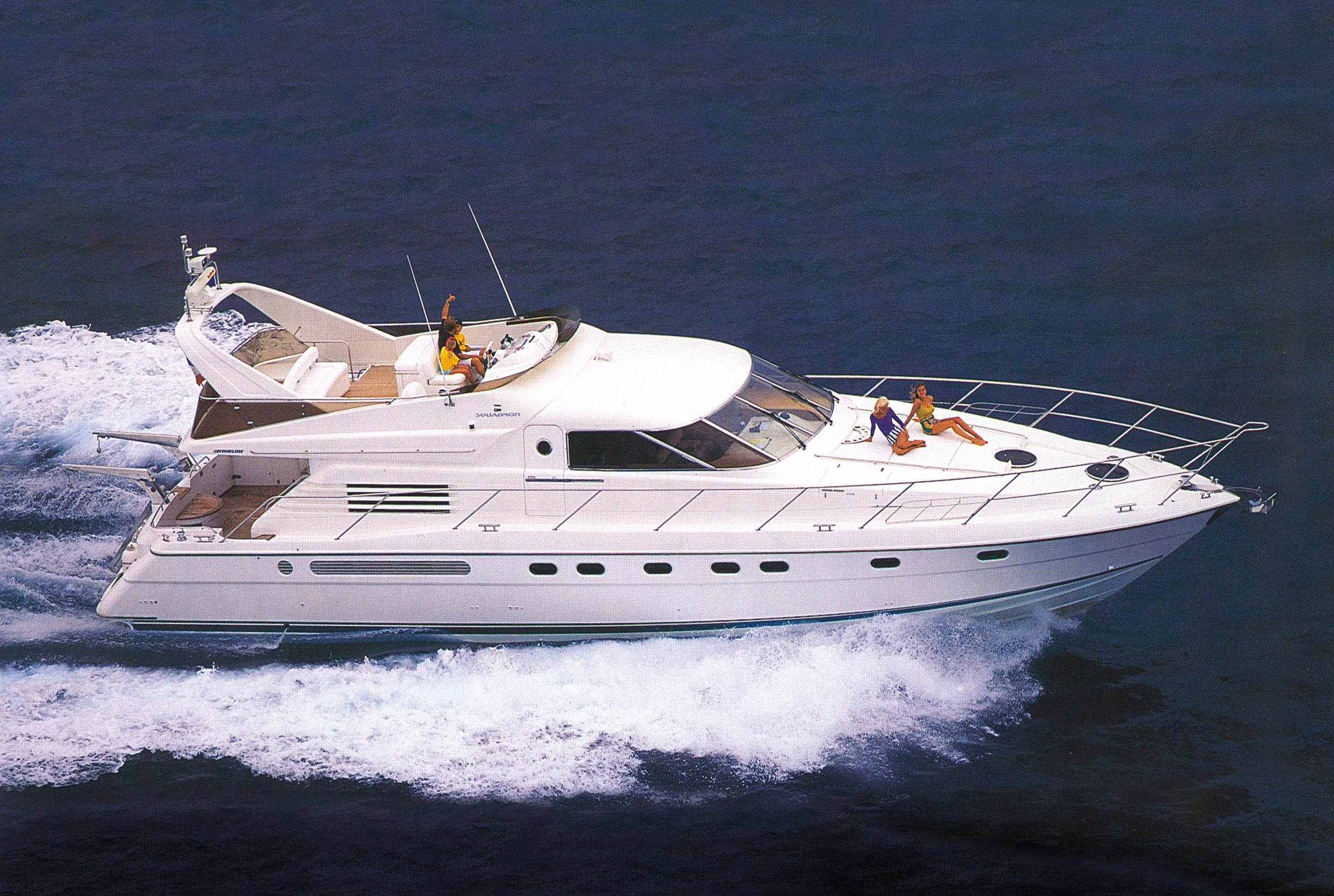 Yacht sailing on dark blue water