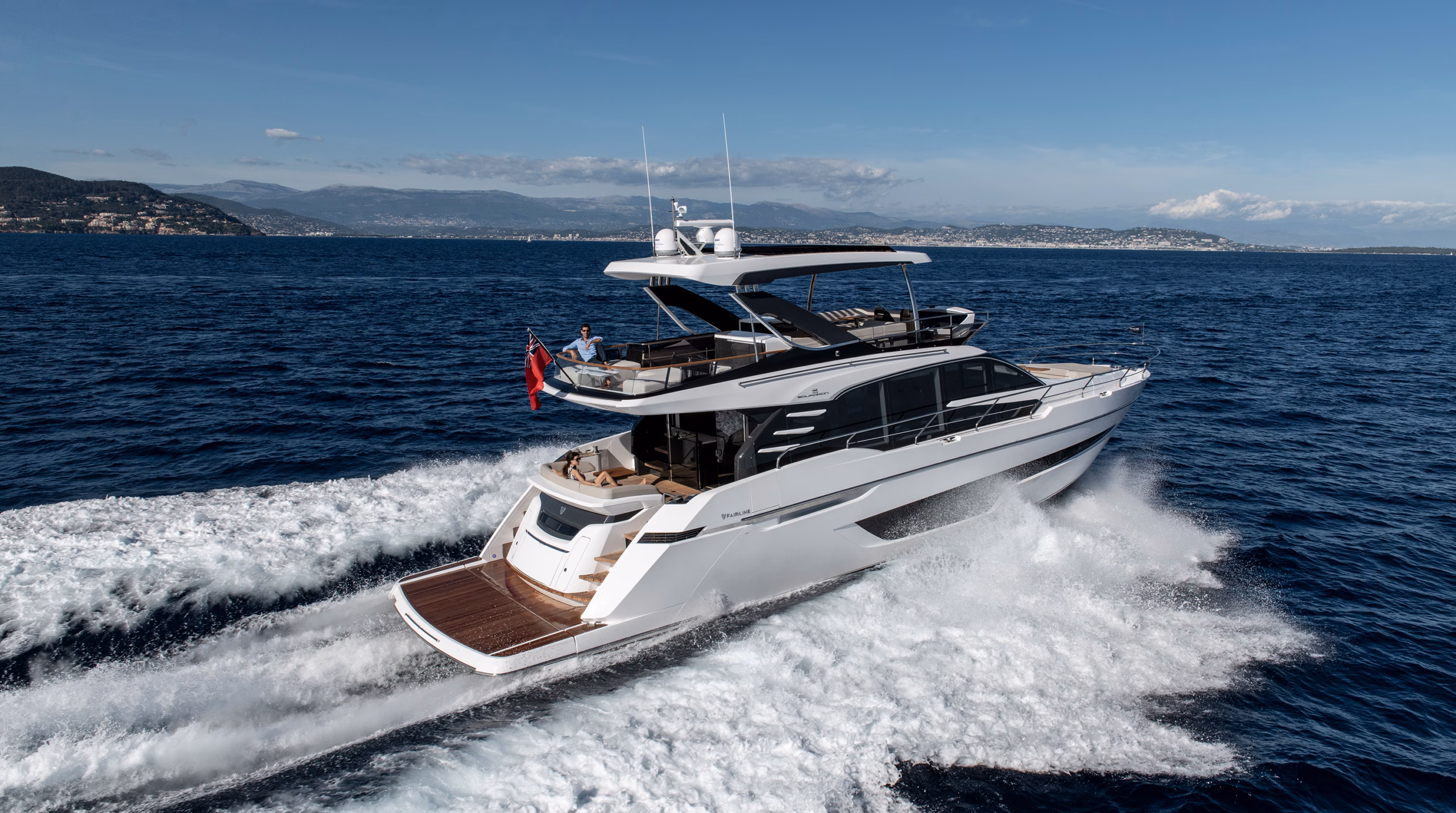 White yacht cruising on blue sea